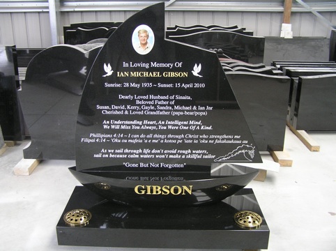 BLACK GRANITE BOAT SHAPED HEADSTONE